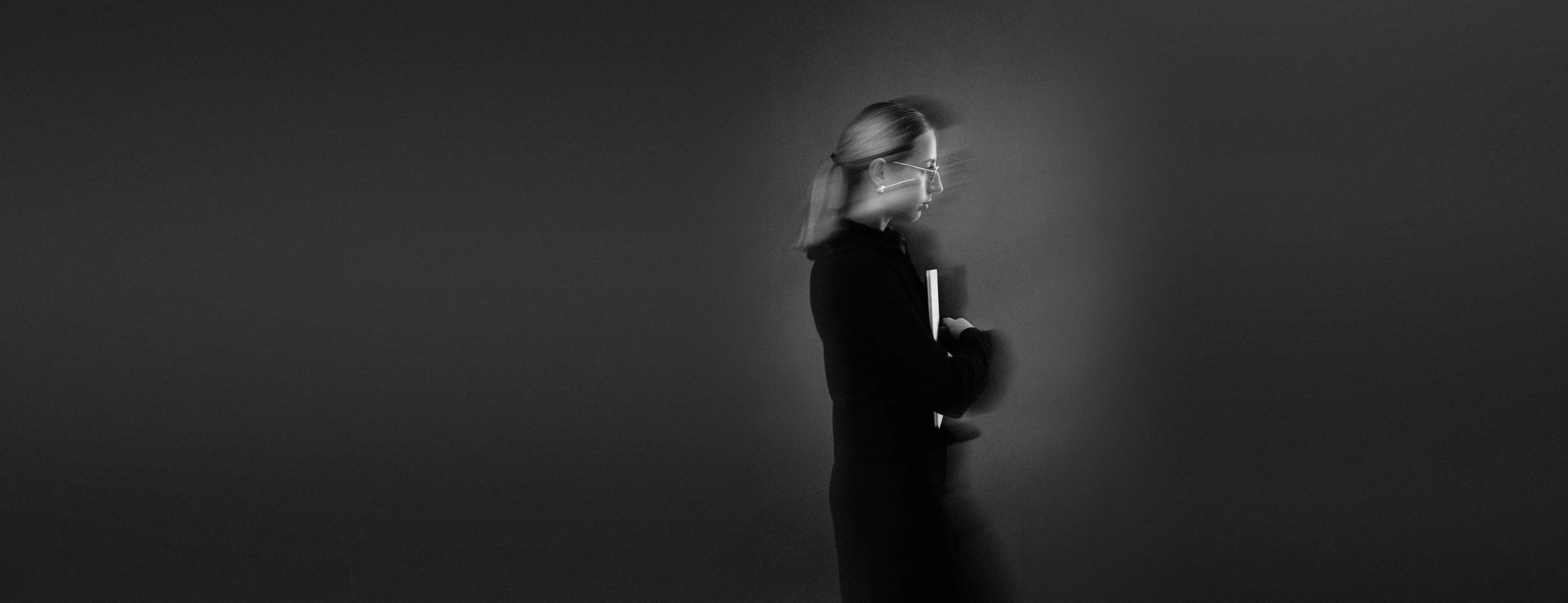 Long-exposure studio portrait of Nataliia in motion